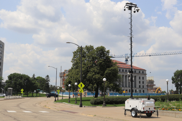Commander 3400 surveillance trailer deployed by government entrance road.