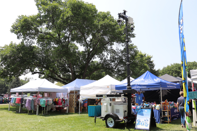 Falcon 3100 mobile surveillance trailer at outdoor festival.