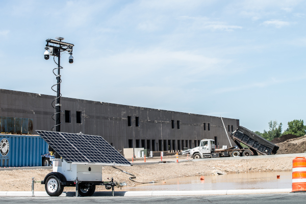 Mobile Pro Systems compact surveillance trailer at construction site.