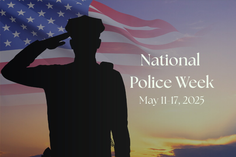 Image graphic featuring the silhouette of a police officer saluting with a sunset and American flag flying in image background; text overlay on image says “National Police Week – May 11-17, 2025”