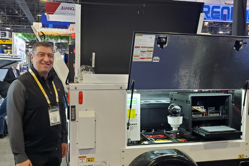 Sam Rosen, CEO, Mobile Pro Systems, stands beside Commander 3400 mobile surveillance trailer at ISC West 2025.